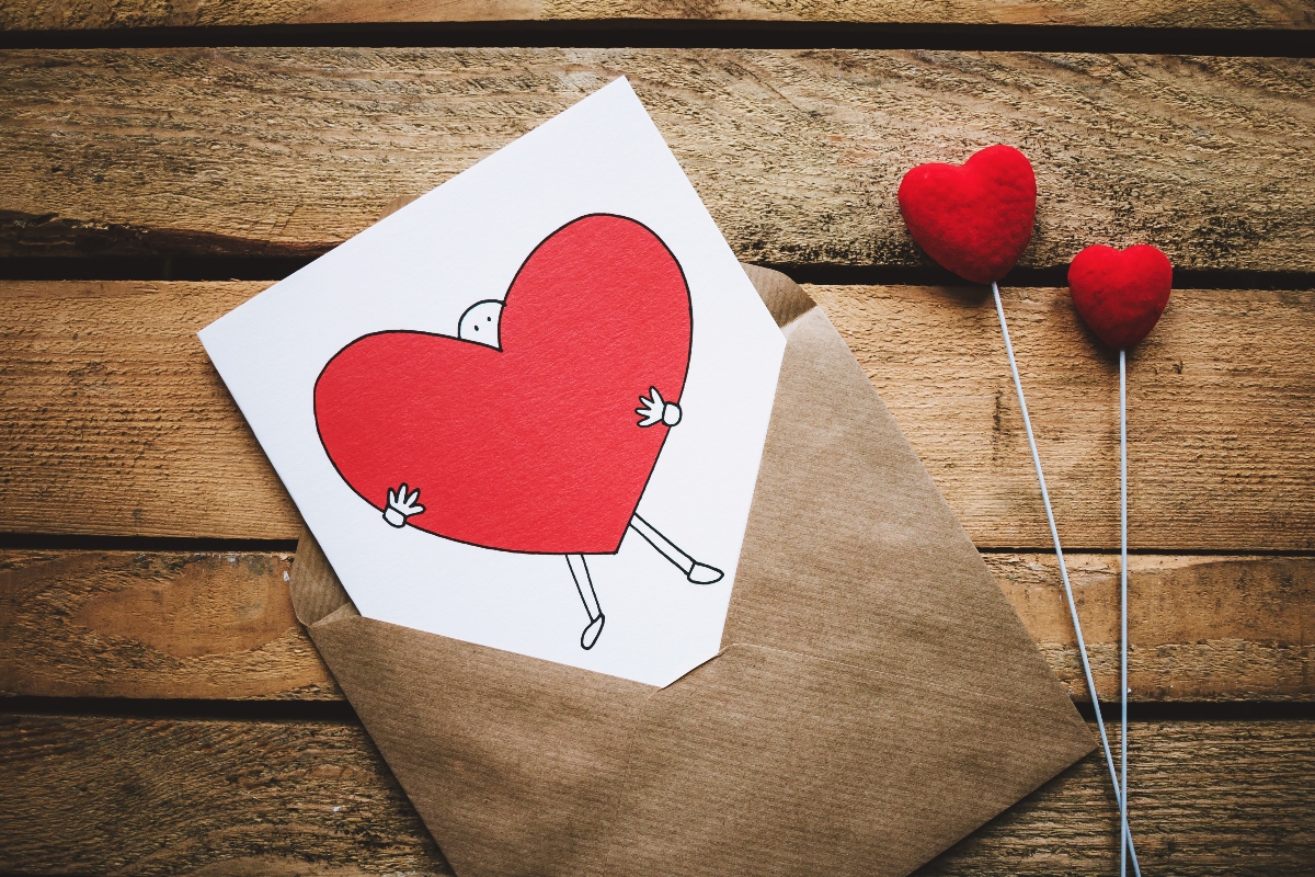 white black and red person carrying heart illustration white black and red person carrying heart illustration