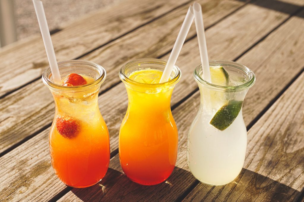 three assorted fruit juice in glasses 1233319 1